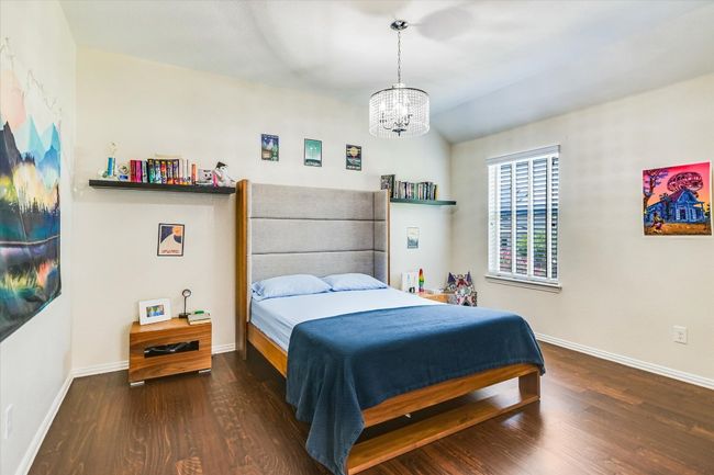 Ensuite bedroom with its own sitting area and desk space. | Image 17