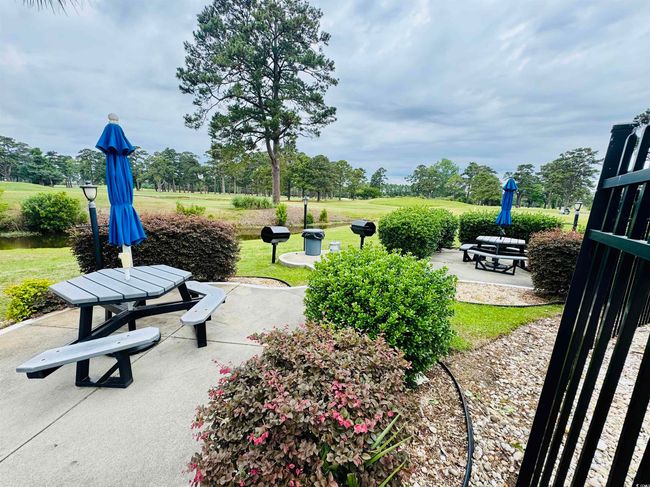 View of home's community featuring a patio area and a lawn | Image 32