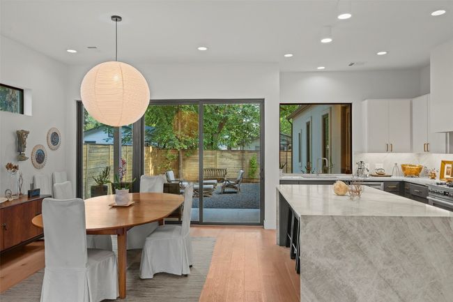 Dining area featuring light wood-style floors and recessed lighting | Image 10