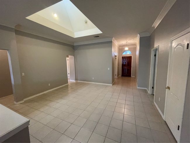 Unfurnished room with ornamental molding and light tile patterned floors | Image 24