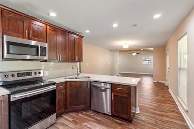 Open floorplan with kitchen open to living and dining area. | Image 2