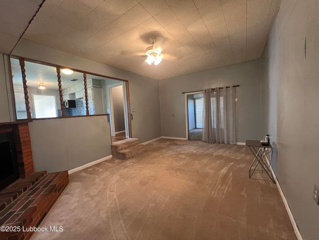 Den has decorative fireplace | Image 9