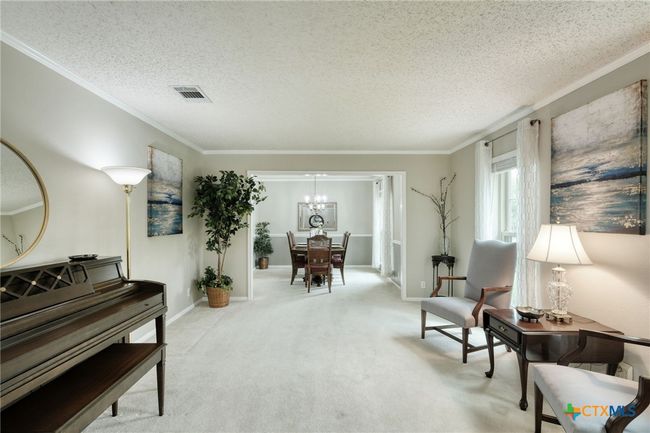 View from the Entry looking at the front living area and formal dining room. | Image 6