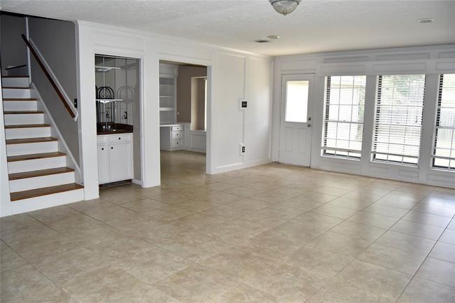 living area leads upstairs or into breakfast room | Image 8