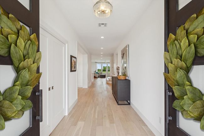 Corridor featuring light wood-type flooring, recessed lighting, and baseboards | Image 6