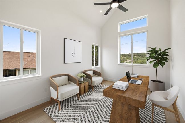 Office with wood finished floors, baseboards, ceiling fan, and high vaulted ceiling | Image 14