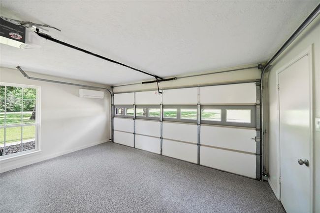 Storage area that was once a garage. Has new door opener and is under its own AC. Perfect man-cave or she-shed. | Image 37