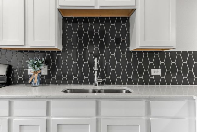 Striking black tile backsplash that adds the perfect touch of contrast. | Image 8