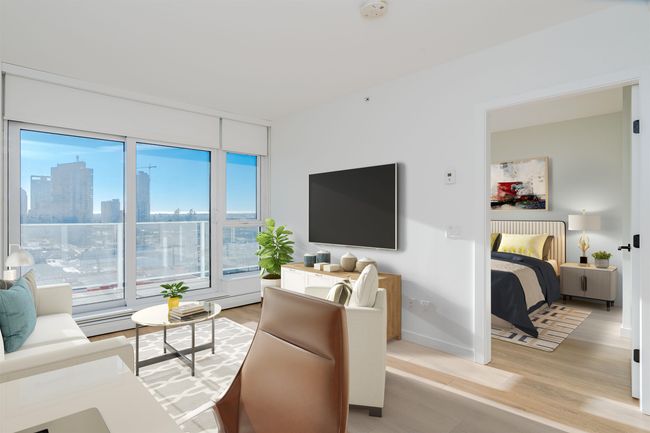 Living room featuring light wood-style flooring and baseboards | Image 8