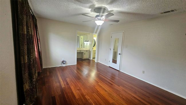 Primary bedroom with ensuite Hollywood bathroom & walk in closet | Image 9