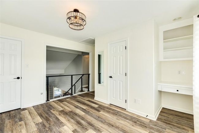 Upstairs "flex room" has a built-in desk with shelving. Would make a great studio, TV room, second office or 4th bedroom | Image 26