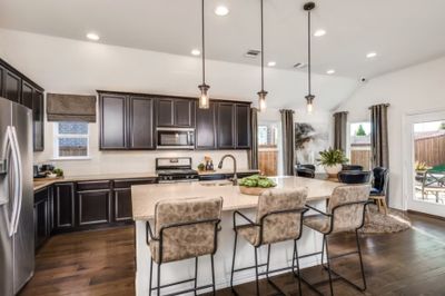 Photo of Pulte model home with same floor plan, not of actual home listed. | Image 3