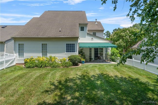 Rear view of property with a patio and a shingled roof | Image 41