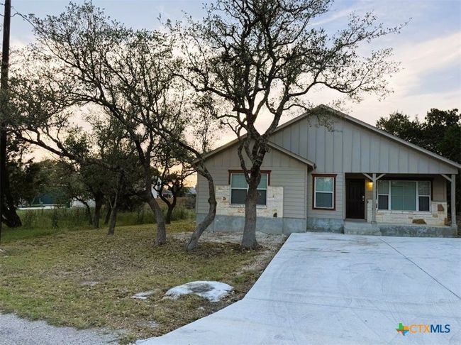 Great front yard, with spacious driveway of this beautiful home. | Image 20