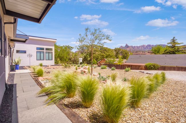 View of yard with a mountain view and fence | Image 48