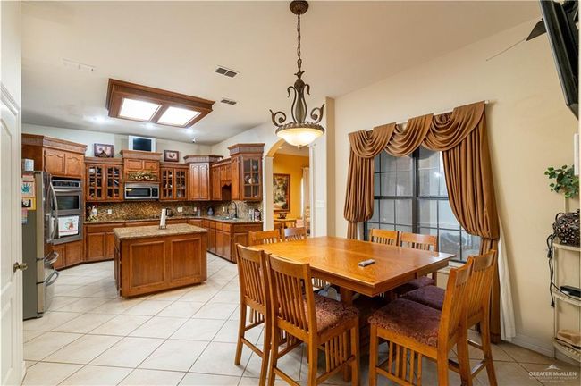 Tiled dining area with sink | Image 13