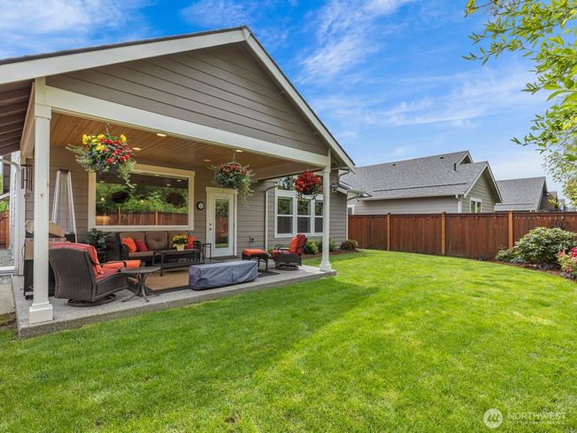 Covered patio is perfect for listening to the birds while enjoying a beverage or dining al fresca. | Image 20