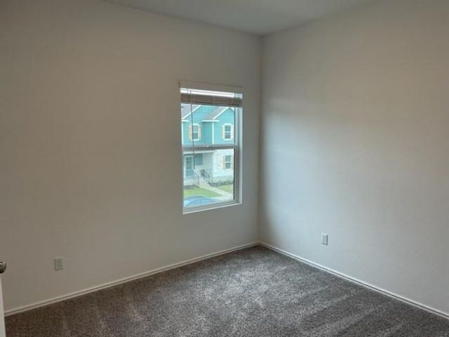 Empty room featuring dark carpet and baseboards | Image 15