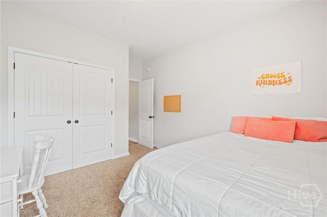 Main level bedroom with double closet. | Image 18
