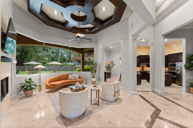 Wood beam-accented ceilings add architectural charm, while clean lines and neutral tones keep the space feeling fresh and current. | Image 15