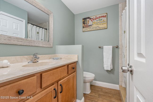 Upstairs Bathroom with Dual Sinks, Solid Surface Countertops & Shower/Tub Combo | Image 27