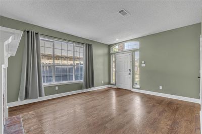 Bright entryway and living room | Image 3