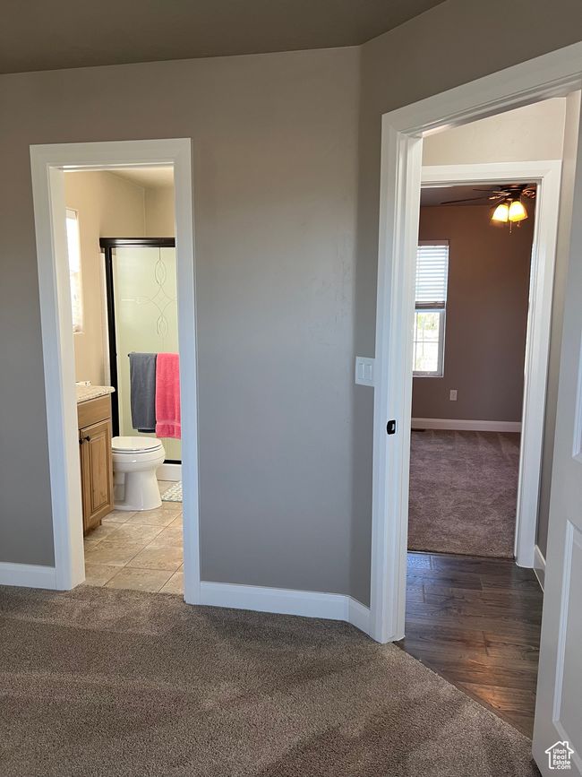 Unfurnished bedroom with light carpet and connected bathroom | Image 43