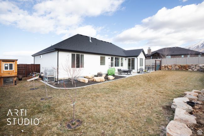 Back of house with a patio and a lawn | Image 44