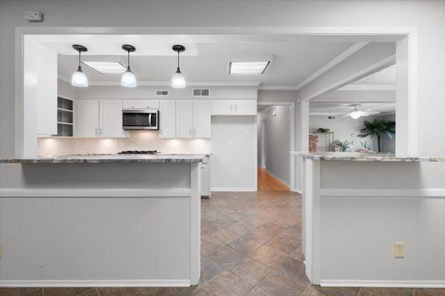View into kitchen from second dining area | Image 14