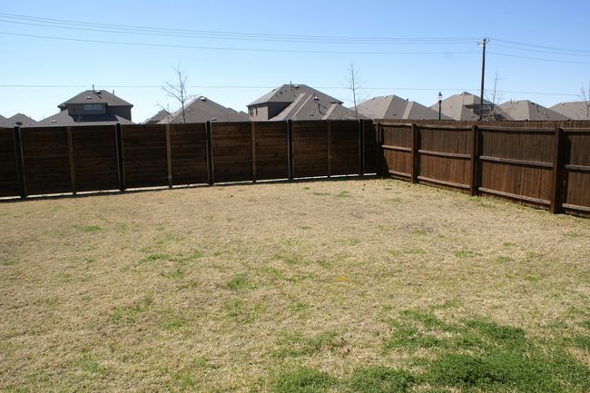 View of yard with a fenced backyard | Image 17