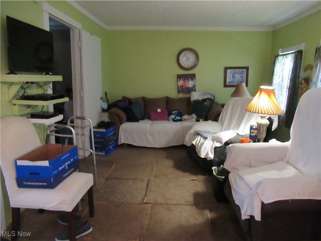 Living room with 2 windows and doorway to Bedroom #1 | Image 11