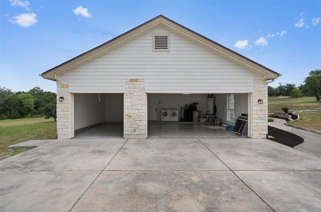 2-car garage + converted single bay garage (has AC) perfect for workshop or studio | Image 33