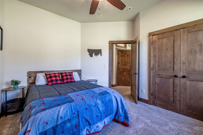 Bedroom featuring carpet floors and ceiling fan | Image 38