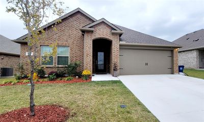 View of front of home with upgraded iron door. | Image 1