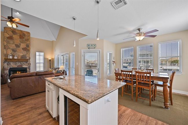 Roomy kitchen island featuring a prep sink, wine fridge, and ice maker for ultimate convenience. | Image 11