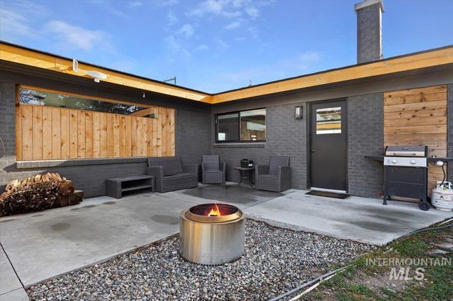 View of patio / terrace with an outdoor fire pit and grilling area | Image 22