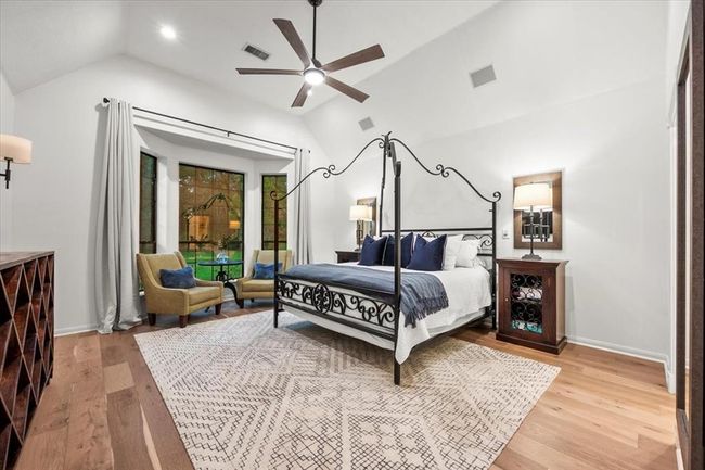 A second angle of the primary bedroom highlights the cozy sitting area and private access to the backyard—ideal for sipping your morning coffee or unwinding at sunset. | Image 22