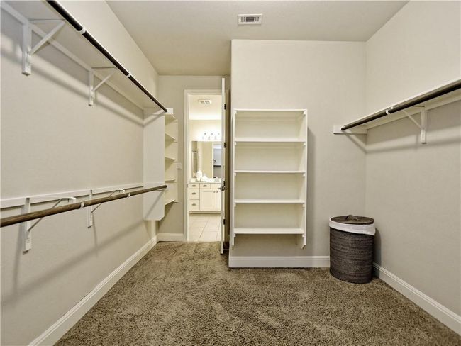 Walk in closet with carpet floors | Image 23