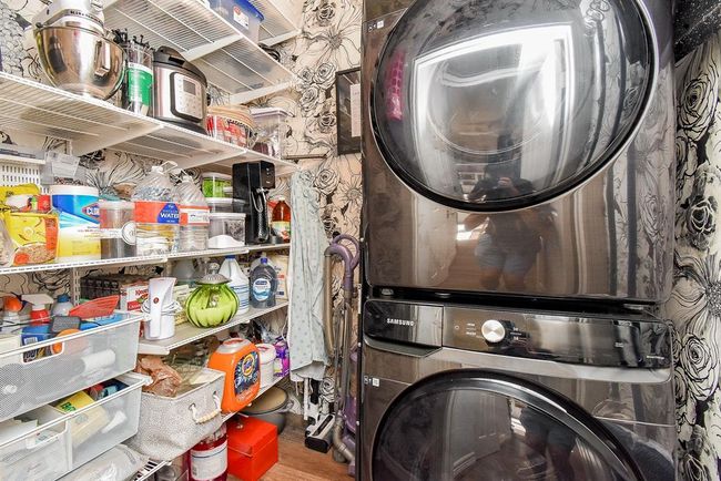 This effecient laundry room is located down the hall from the kitchen and next to the guest bath. | Image 24