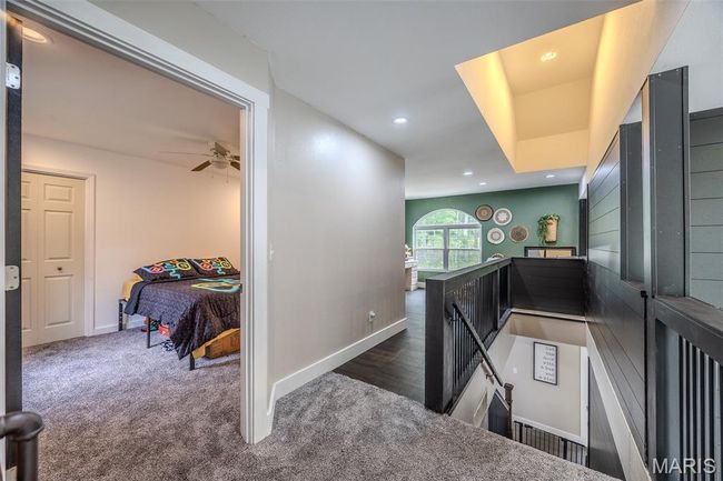 Hallway with an upstairs landing, recessed lighting, and carpet flooring | Image 36