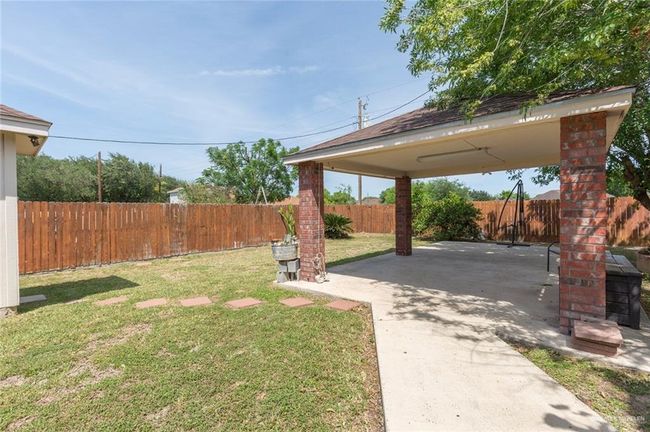 View of yard featuring a patio area and a fenced backyard | Image 11
