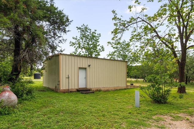 View of outdoor structure with entry steps | Image 30