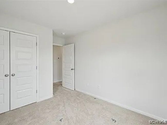 Unfurnished bedroom featuring a closet and carpet | Image 25