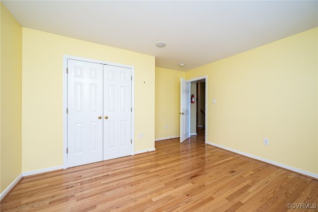 Unfurnished bedroom featuring light wood-style floors and a closet | Image 25