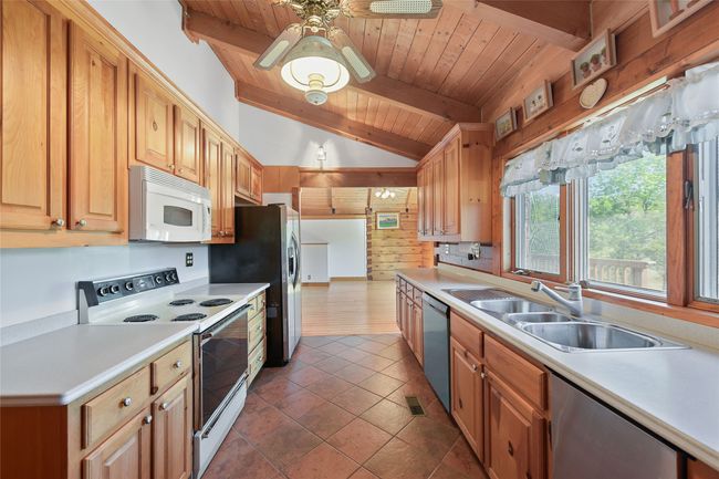 View of kitchen upon entering home. View of Great Room. | Image 4