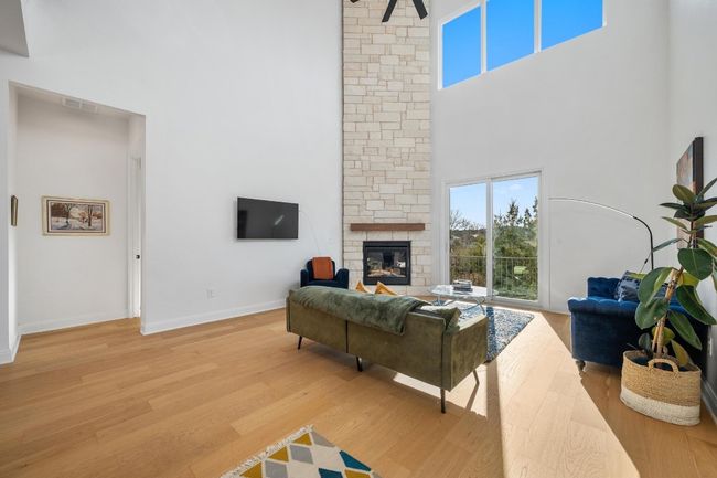 Designed for elegance and functionality, this home boasts a seamlessly integrated open floor plan connecting the living room | Image 12