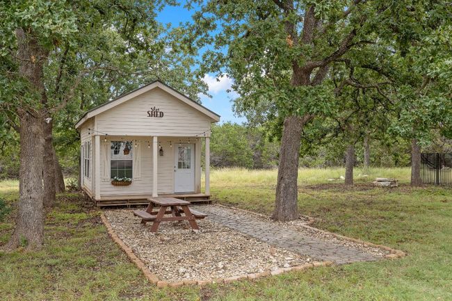 Hobby shed with dedicated outdoor space and lights. | Image 32