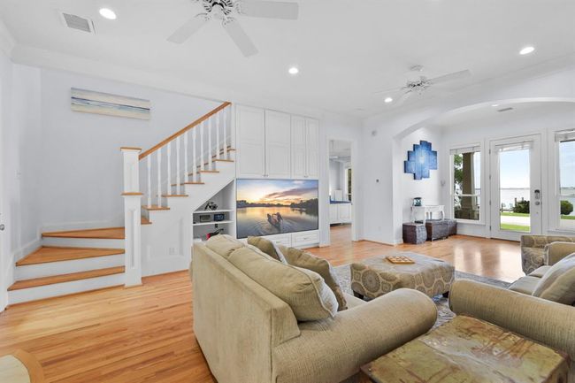 The primary bedroom is conveniently located next to the den, all on the same level for easy access. | Image 14