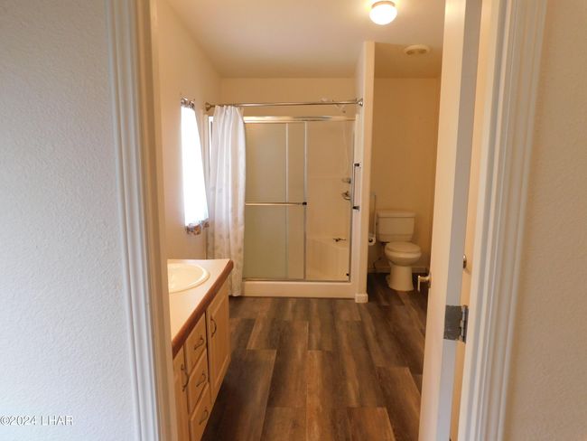 Master bedroom to master bath. | Image 22