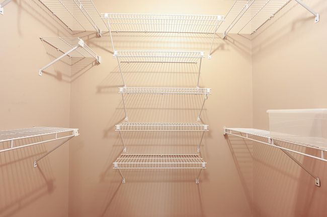 Ample shelving and storage solutions in this well-designed walk-in closet, maximizing organization and accessibility. | Image 18